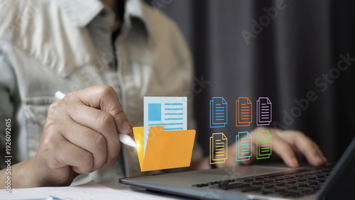 Digital document management concept with professional organizing virtual files and folders on laptop. Data storage, cloud archive, paperwork automation, information system,