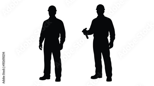 Silhouettes of two construction workers one holding a tool against a white background