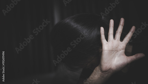 stop violence against Women. A woman holds up her hand in a stop gesture, looking distressed, symbolizing the fight against violence and abuse. ,sexual abuse, human trafficking