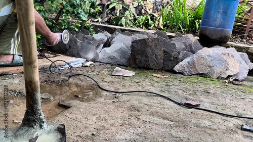 the process of cutting granite stone using cutting tools, electric grinder