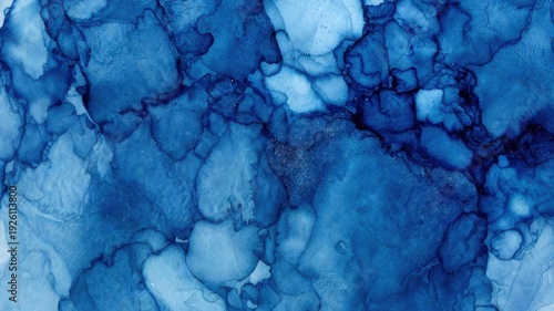 Abstract blue watercolor texture with organic patterns and fluid shapes.