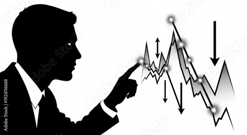 Businessman pointing at declining financial graph