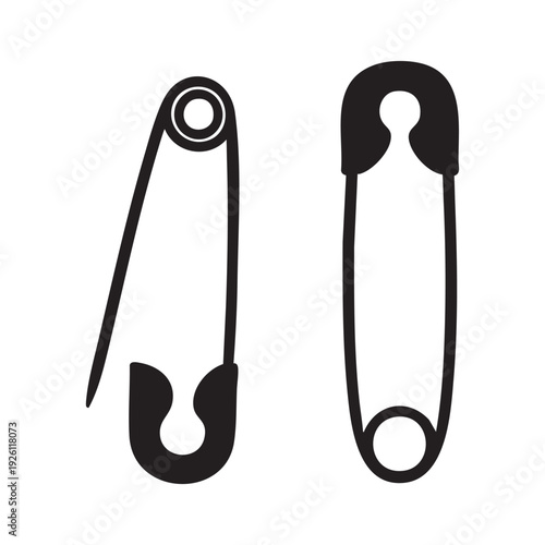Two safety pins on a white background