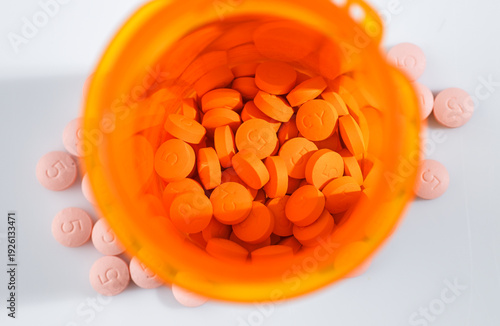 Close up of Round Pink Statin Pills with Number 5 for Dosage on Them