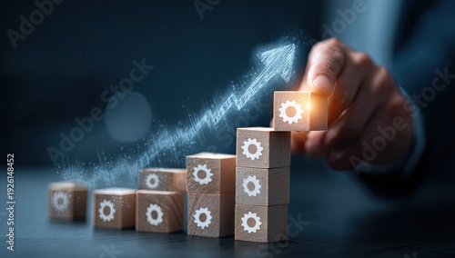 Business Growth Concept - Hand Stacking Blocks with Upward Arrow and Gears.