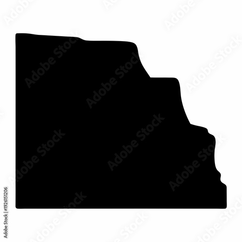 Black silhouette of rugged, irregular, rocky cliff face on a white background