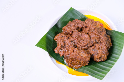 Wallpaper Mural Rendang is traditional food from West Sumatra, Indonesia. It is made from beef stew and coconut milk with various herbs and spice. Isolated on white background Torontodigital.ca