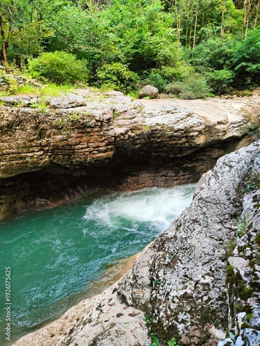 Picturesque mountain river in a misty forest, wild nature background, serene canyon wallpaper