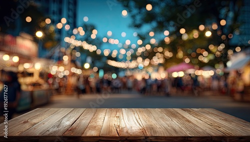 Rustic wooden table in foreground, blurred night market with glowing lights