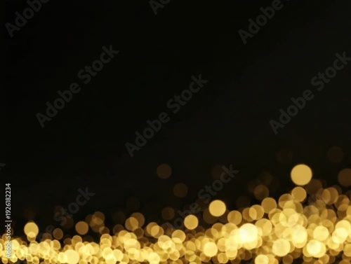 A stunning video of golden particles flowing across a dark background