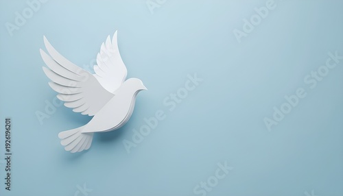 White dove in flight on soft blue background symbolizing peace