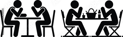 Two groups of people sitting at tables, one group appears to be having a serious conversation.