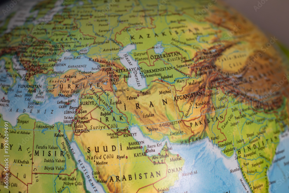 Naklejka premium World map with focus on Iran. The United States and Iran are on the brink of war. Political tension or crisis. Part of the world map. Middle Eastern countries are in focus. Selective focus. No people