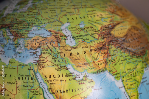 World map with focus on Iran.  The United States and Iran are on the brink of war. Political tension or crisis. Part of the world map. Middle Eastern countries are in focus. Selective focus. No people