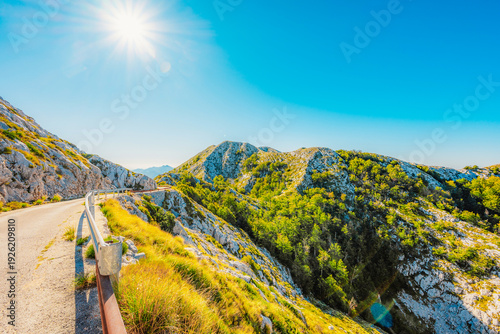 Schilderij op canvas Rugged karst landscape of Biokovo Nature Park with white limestone rocks and sparse mediterranean vegetation, Dalmatia, Croatia
