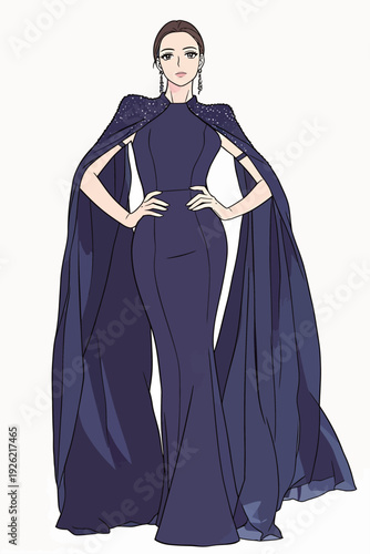 A woman stands confidently, wearing a blue dress with a long cape. She poses for the camera at a fashion show inside a studio.