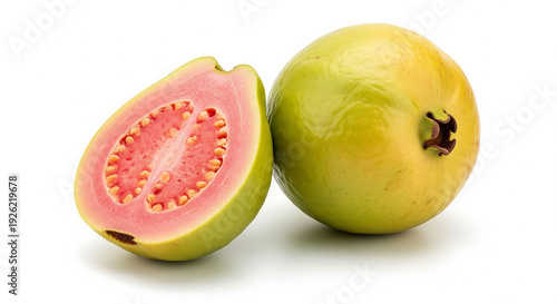 Pink guava sliced showcasing vibrant interior texture seeds and fresh green exterior