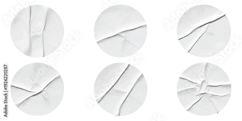 A collection of six wrinkled white paper circles with various creased and distressed textures on a clean background