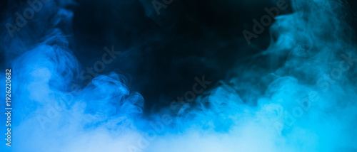 Colorful smoke with blue flare isolated on a black background. abstract neon gradient cloud with splash. thick swirling dust and powder creating a psychedelic light design. smog effect