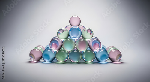 Wallpaper Mural A geometric arrangement of clear colorful balls stacked carefully in a pyramid shape on a grey surface Torontodigital.ca