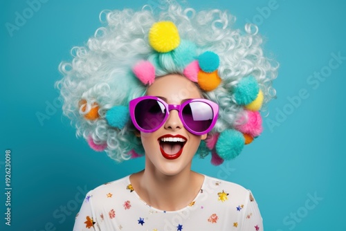 Wallpaper Mural Woman smiling with creative hairstyle and vibrant pompoms on a blue background Torontodigital.ca