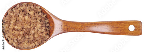 Fotografie Isolated brown rice in wooden spoon on a white background