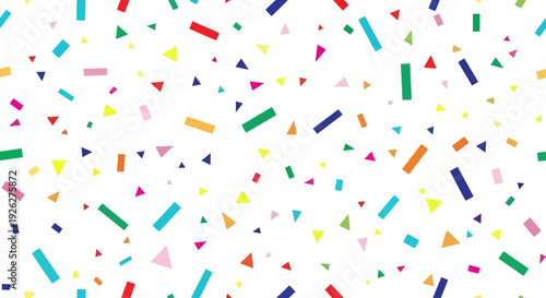 Vibrant colorful confetti pieces are scattered across a white surface in a lively celebration scene with geometric shapes and festive decorations.