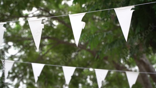 Party decorative fabric garland isolate.White triangular bunting against a natural background.