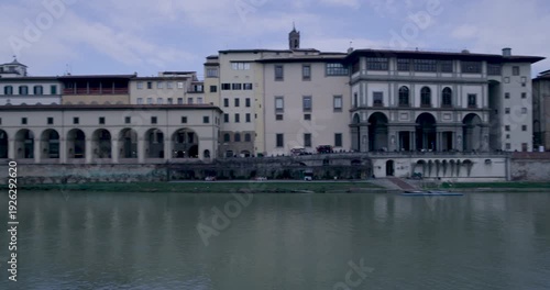 Historic Bridge Wall with Carved Messages Overlooking Arno River, Florence
