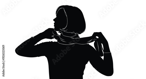Silhouette of a woman adjusting a scarf around her neck with elegance and poise