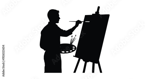 Man is painting on a canvas using a palette full of paint