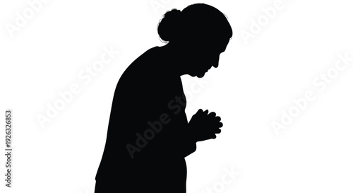 Silhouette of a person praying with hands clasped together in contemplation and reflection