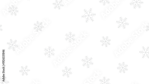 Delicate Snowflakes Falling Gently on White.