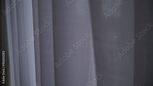 view of the river can be seen through the translucent curtains.