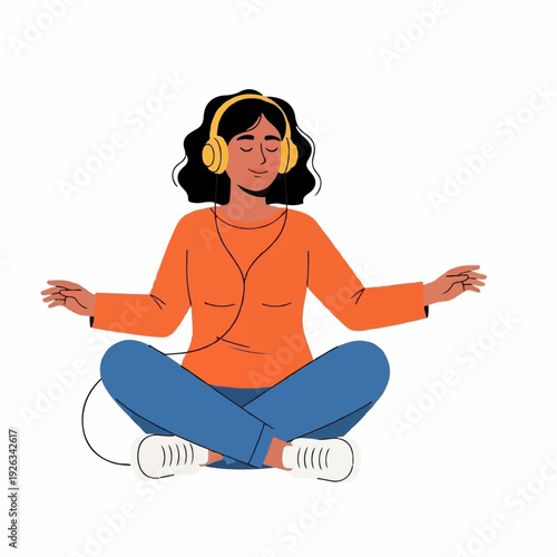 Calm woman meditates serenely sitting cross-legged while listening to music through yellow over-ear headphones for relaxation.