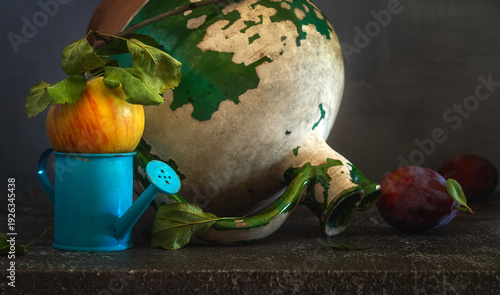 Still life with ripe and delicious plums, an apple and an old ceramic jug.