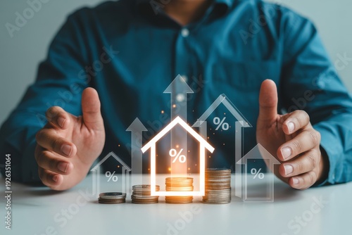 Businessman Protecting Stacked Coins with Real Estate House Icons and Rising Percentage Interest Rates