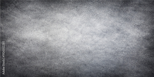A dark aged grunge metal texture with a brushed gray concrete pattern creates a dirty vintage surface on this rough black industrial wall backdrop