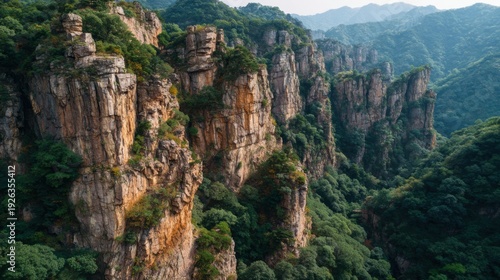 a photo of the majestic cliff wall at long dao park in shandong province, china. the picture captures the rugged beauty and natural grandeur of these cliffs
