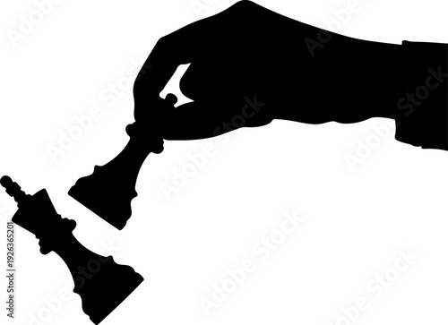 Hand holding chess piece