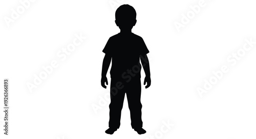 Silhouette of a young child standing against a bright white background