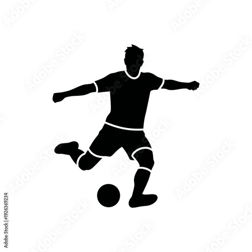 Professional soccer player kicking ball in dynamic action