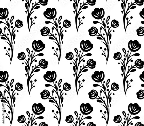 Seamless monochrome floral pattern in tracery folk art style. Vector surface design with black silhouette of flowers