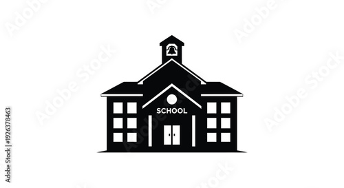 Classic schoolhouse building with a prominent steeple black silhouette