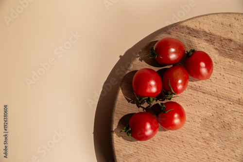 Fresh Red Cherry Tomatoes on Wooden Board