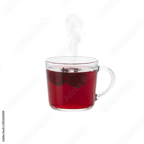 A closeup of a healthy hot roselle tea red tone in a transparent glass isolated on white for a cozy breakfast refreshment
