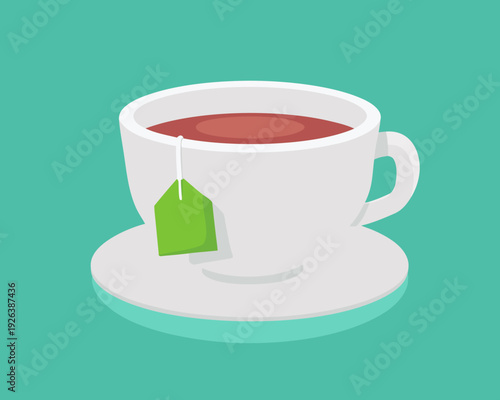 A white cup of hot tea with a green tea bag on a saucer