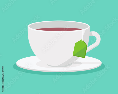A white cup of tea with a green teabag on a saucer