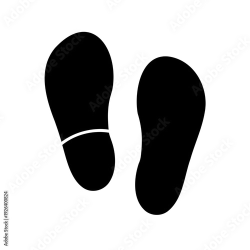 Black silhouette of foot prints representing shoes or bare feet impression