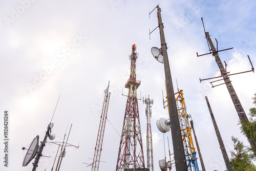 Canvas Print A group of telecommunication broadcasting towers with antennas on top of them